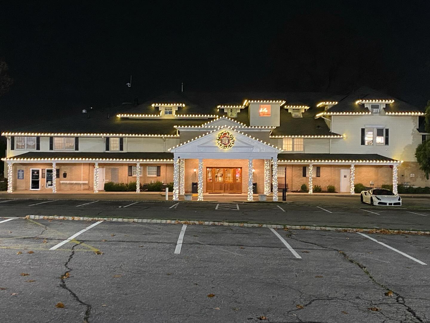 Commercial holiday lighting NJ building warm white column wrapping