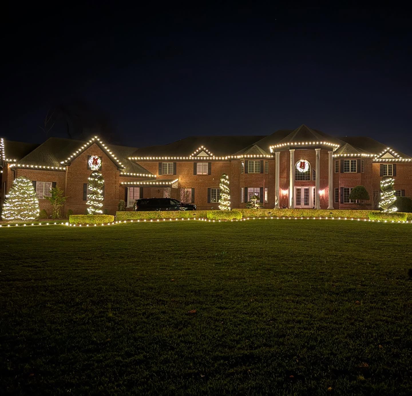Large brick estate holiday lighting NJ full property